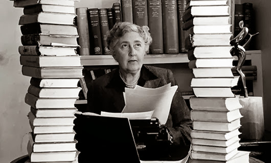 Volume 2, Page 114, Picture, 21. Literature Mystery author and writer, Agatha Christie, pictured at her home, Winter-Brook House, sitting behind her desk with books piled high. Volume 2, Page 114, Picture, 21. Literature Mystery author and writer, Agatha Christie, pictured at her home, Winter-Brook House, sitting behind her desk with books piled high.