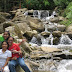 Posing by the cascading river Posing by the cascading river