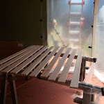 sanded louver board getting a coat of poly to seal them up. the impromptu spray booth setup around the back patio works well - keeps out bugs n dirt while providing some ventilation. 2011-07-15 12.44.40.jpg