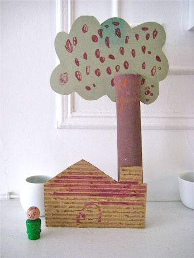My son made this house tree combo. A slit cut in the top is an easy way to attach the paper foliage