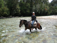 Fording the river on horseback