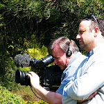 Peter filming with Simon directing an interview. Peter filming with Simon directing an interview.