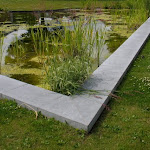 5 - Wall copings around a pool of water