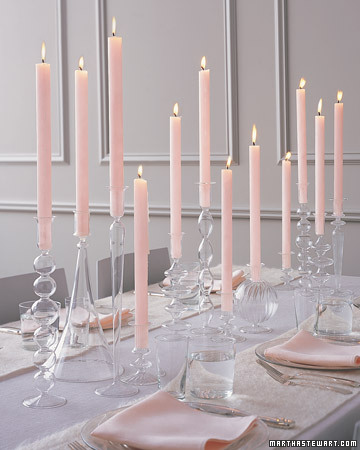 In lieu of floral arrangements, display sleek tapers in a variety of shapely glass candlesticks. Mix them in varying heights and designs to create a sophisticated, chic setting. (marthastewartweddings.com) In lieu of floral arrangements, display sleek tapers in a variety of shapely glass candlesticks. Mix them in varying heights and designs to create a sophisticated, chic setting. (marthastewartweddings.com)