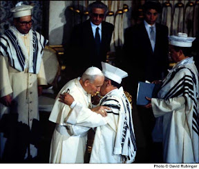 In 1986, Pope John Paul II became the first Pope to visit a synagogue in 2000 years.  At the Rome synagogue he embraced Italian Chief Rabbi Elio Toaff..jpg