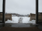 It's pouring rain and there are ice-cold puddles everywhere to freeze our little feet.