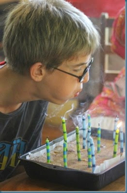 Benjamin blowing out candles