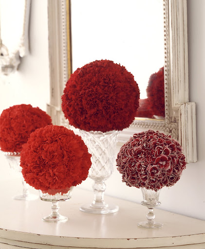Carnations are one of my favorite flower, I love the different red shades of carnations in this photograph -- these arrangements make a simple but stunning centerpiece. Carnations are one of my favorite flower, I love the different red shades of carnations in this photograph -- these arrangements make a simple but stunning centerpiece.