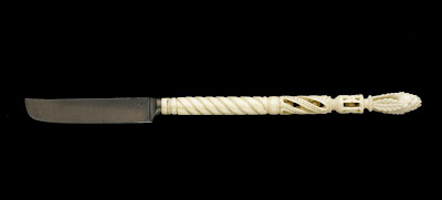 Pen knife | Origin:  Turkey | Period: 18th-19th century  Ottoman period | Details:  Not Available | Type: Tooth ivory, red inlay (probably coral), metal | Size: H: 20.5  W: 1.3   D: 1.2  cm | Museum Code: S1991.6 | Photograph and description taken from Freer and the Sackler (Smithsonian) Museums.