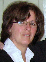 Ferdeze, Assists with Bookkeeping when Burim is in Uganda