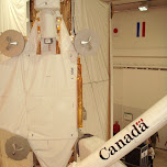 the canada arm with the dutch and japanese flag in the backgroound in Cape Canaveral, United States 