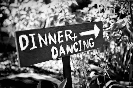 The groom made all of the hand-painted signs. The groom made all of the hand-painted signs.