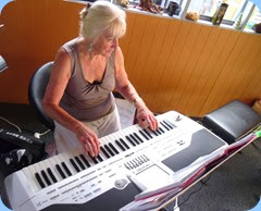 Delyse Whorwood, the Club Secretary,  making one of her rare musical forays on Yvonne Moller's Korg Pa1X