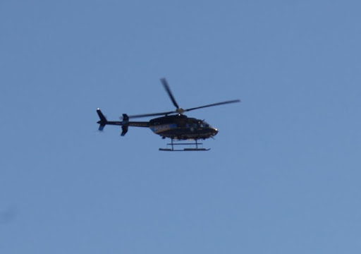 Sharkey!  The letters on the side say POLICE!  I think these are the good guys.  Stop being such a worry-wart!