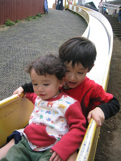 Kai and Eidan on the long slide at Robot Park