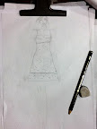 An early sketch of the dress Rosma wore to cocktail hour. After shopping for fabric and continued discussion, it became a longer dress with the orange color blocking on the bottom.