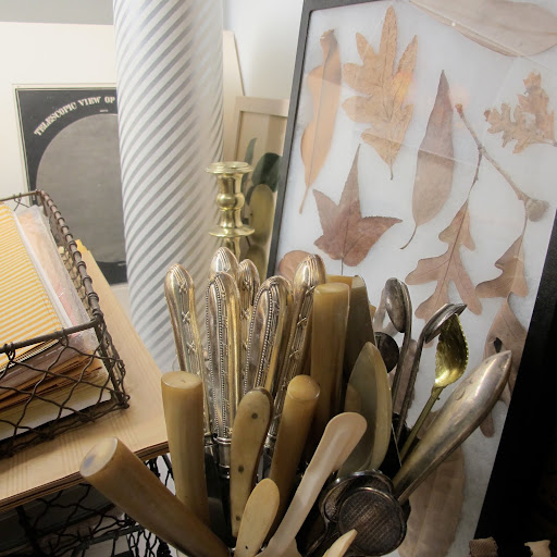 A collection of knives with various types of handles and a sampler of leaves can be found in a separate corner of the office. A collection of knives with various types of handles and a sampler of leaves can be found in a separate corner of the office.