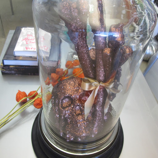 Here it is! I put together this arrangement of bones and a scull with a little satin ribbon and a refined glass case. Here it is! I put together this arrangement of bones and a scull with a little satin ribbon and a refined glass case.