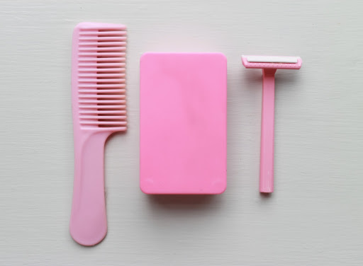I love these worn pink plastics (comb, travel soap dish, single-blade razor)