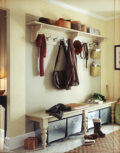 Galvanized rolling bins are an easy solution to organize shoes and other outerwear accessories under an entryway bench. Casters allow for easy access.