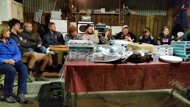 A tired group of exhibitors at the annual pizza & chips after judging.jpg