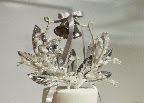 The beautiful cake topper made with millinery flowers and leaves. The beautiful cake topper made with millinery flowers and leaves.