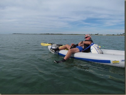 al putting on wetsuit in kayak