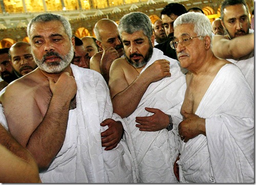 epa00926738 Palestinian President Mahmoud Abbas (R), Hamas leader Khaled Meshaal (C|) and Palestinian Prime Minister Ismail Haniyeh walk inside the Grand Mosque in Mecca early on Friday 09 February 2007. Rival Palestinian factions sign a deal to form a unity government, hoping to end bloodshed between their followers and to win back Western aid halted because of the hostility of Hamas to Israel.  EPA/SUHAIB SALEM / POOL
