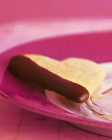 Heart-shaped shortbread cookies, dipped in chocolate, make a nice gift Heart-shaped shortbread cookies, dipped in chocolate, make a nice gift
