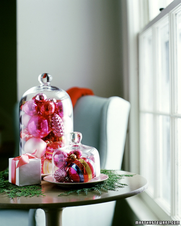 Filled with sparkly trimmings, these garden cloches add radiance to any tabletop. Filled with sparkly trimmings, these garden cloches add radiance to any tabletop.