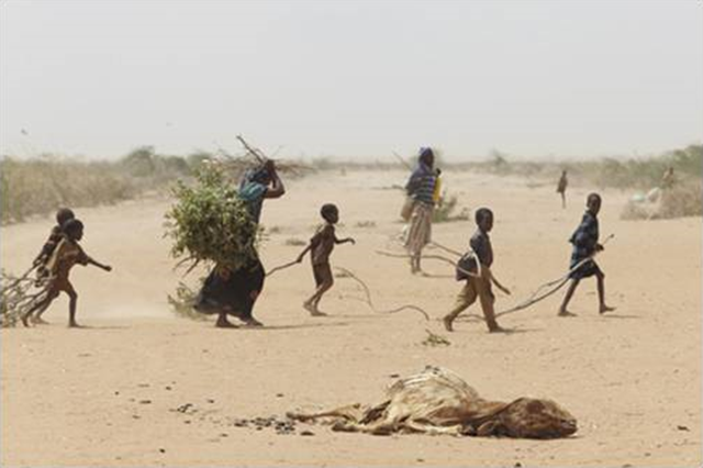 A family in Kenya treks across desert, 2 April 2012. Executive Briefing Book