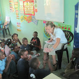The first grade class participating in morning meeting with Profe Sarah.