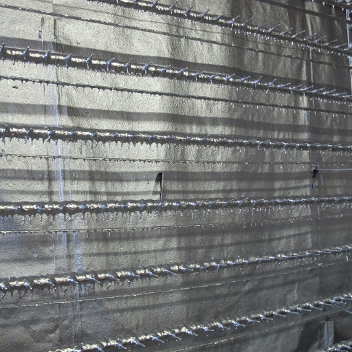 These racks are where they dry finished fixtures. The racks look like dripping, silvery ice.