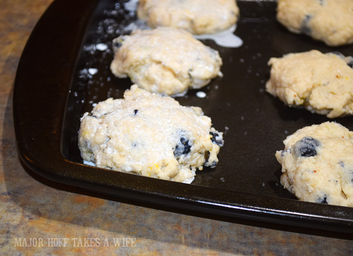 Add sanding sugar to the top of a scone for a nice sweet crunch. A melt in your mouth recipe for blueberry scones. Inspired by Starbucks in house version, this blueberry scone with hints of lemon and a crunchy sugary top will delight everyone. Serve during High Tea, or just as a mid afternoon snack. Perfect along side tea or coffee, or as a stand alone blueberry dessert. You won't believe how easy these are to make! Never made scones before? Never fear, this includes a step by step tutorial on how to make scones. #HighTea #blueberries #Starbucks #scones #dessert Add sanding sugar to the top of a scone for a nice sweet crunch