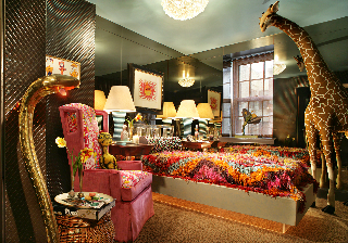 The snake floor lamp in the foreground belonged to Sir Elton John. (Harry Heissmann Inc.)