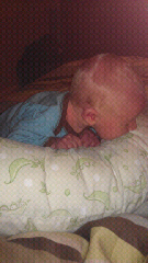 Charlie eating the boppy