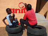Virgin Unite (along with Richard Branson's game lodge, Ulusaba) brought over some volunteers in May and one of their projects was building an outdoor kitchen for a creche (pre-school) that Pride 'n Purpose also sponsors. So, they recently asked our Art Club to paint the logo on it and design something nice for the wall. I picked a few of the best boys and let them have at it! I only supervised and watched them do all the work; they've really become quite good! South Africa - 411.jpg