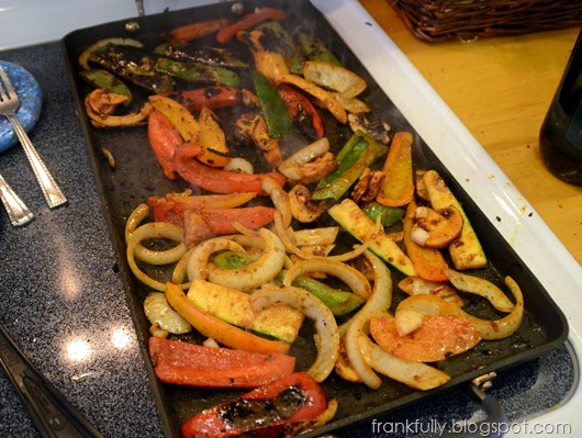 veggies cooking on the griddle