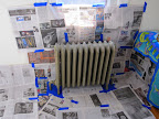 Preparing to paint the radiator in Maria's office room