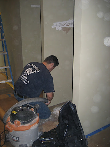 Here they go, removing the wall.