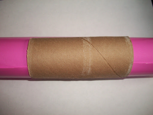 A tube cuffed around the gift-wrap.