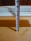 My floor is not at all level, so I used a tape measure to get both ends at an even height from the bench surface.