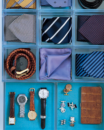 Square acrylic organizers give ties and belts their own homes. Underneath, blue acid-free mat board lines the drawer for extra color. Additional trays are cushioned with coordinating felt to protect the jewelry inside. Square acrylic organizers give ties and belts their own homes. Underneath, blue acid-free mat board lines the drawer for extra color. Additional trays are cushioned with coordinating felt to protect the jewelry inside.