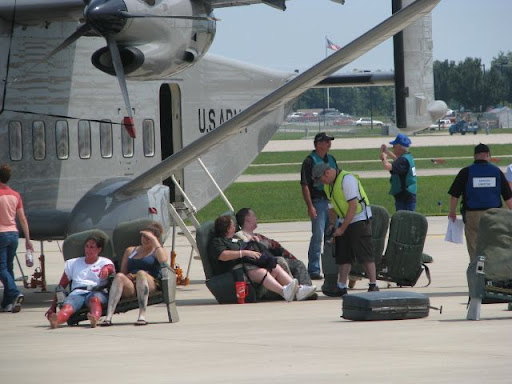 Actors posing as injured passengers in the drill wait for emergency responders to attend to them.