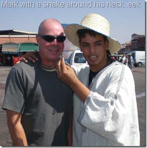 Mark with snake around his neck