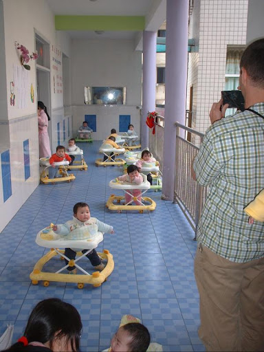 Chinese orphans roll in walkers in the Lily Orphan Care Center in Fuling, China. (Photo provided by John Prescott)