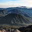 Descending from Semeru as Bromo erupts in the distance