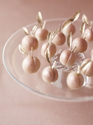 Life is a bowl of... marzipan cherries; we covered dried sour cherries in marzipan and luster dust, then added faux leaves for a touch of gold. (Martha Stewart Weddings) Life is a bowl of... marzipan cherries; we covered dried sour cherries in marzipan and luster dust, then added faux leaves for a touch of gold. (Martha Stewart Weddings)