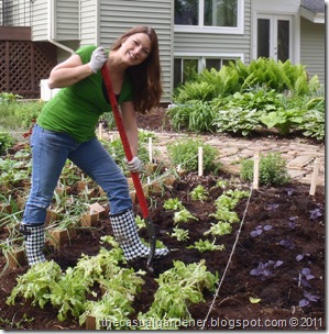 Shawna digging in her front lawn veggie garden