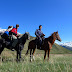 Phil and Damir saddle up to ford a river near Kosh Dobo, Kyrgyzstan